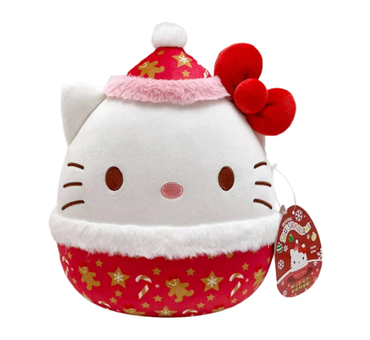 Plush toy resembling a cat with a Santa hat and candy cane pattern on a white background