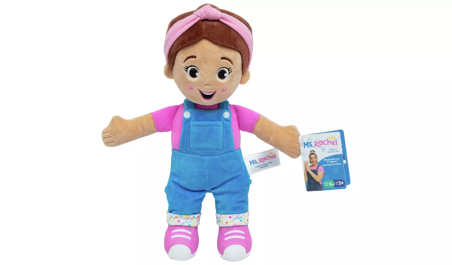 Plush doll with pink shirt, blue overalls, and pink headband on a white background