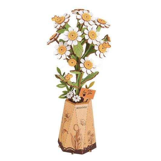 Decorative flower arrangement with a wooden vase on a white background