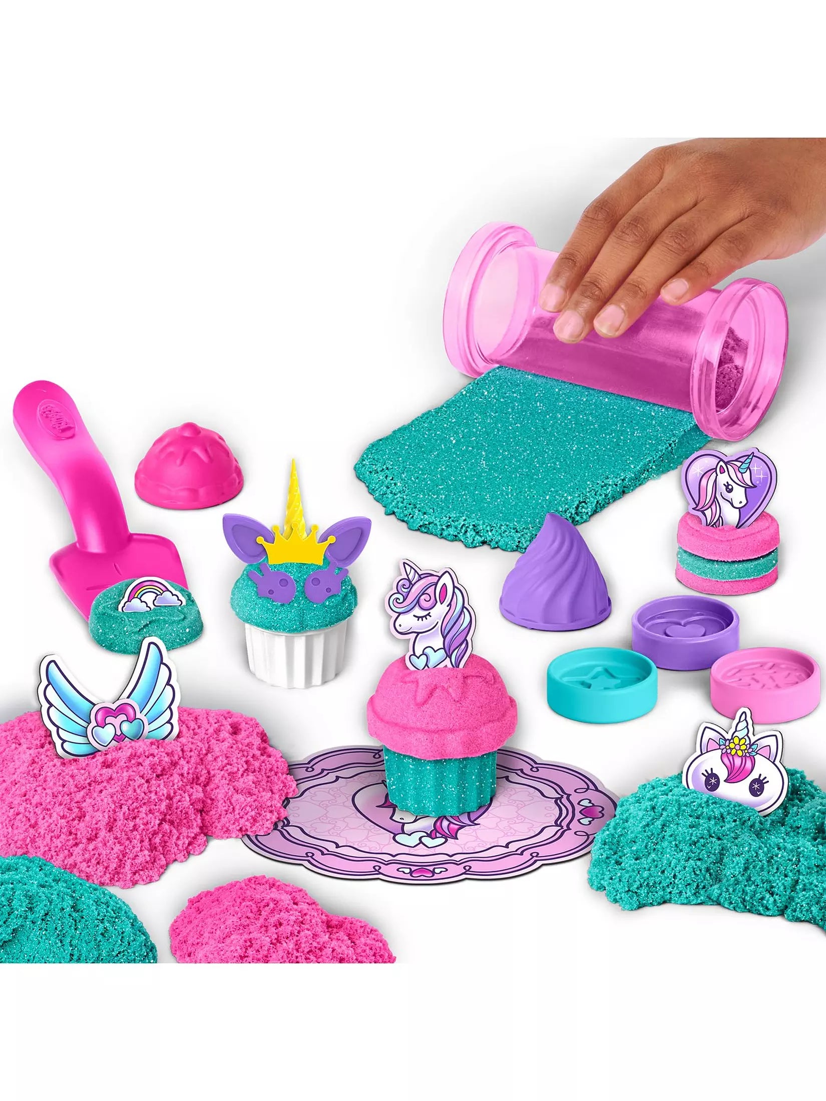 Unicorn-themed sand playset with sand, tools, and molds on a white background