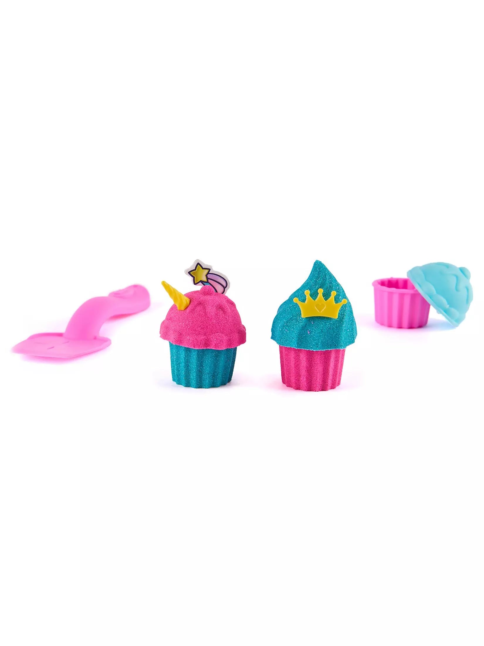 Colorful cupcake-shaped toys with decorative elements on a white background